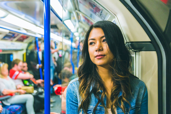 lady on tube thinking about thyroid testing in oxford street